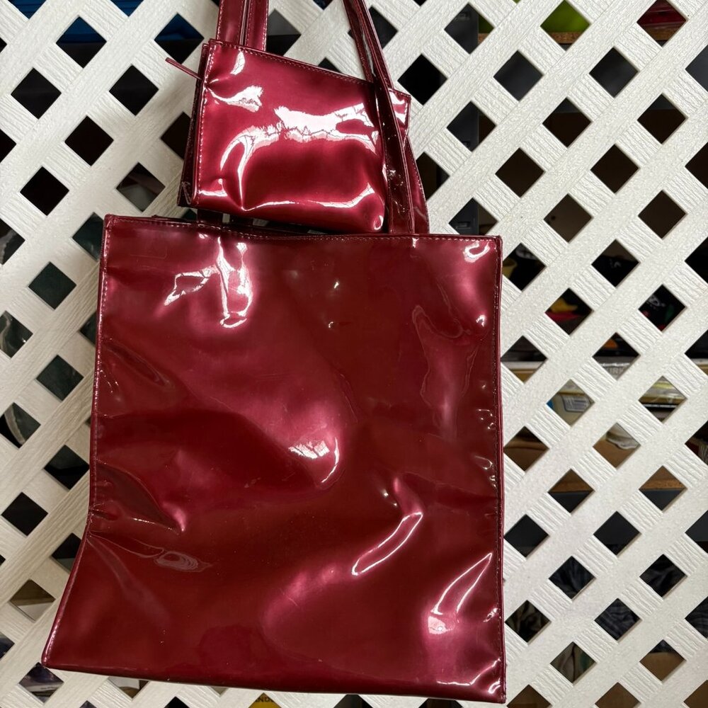 Estée Lauder red patent tote bag and makeup bag